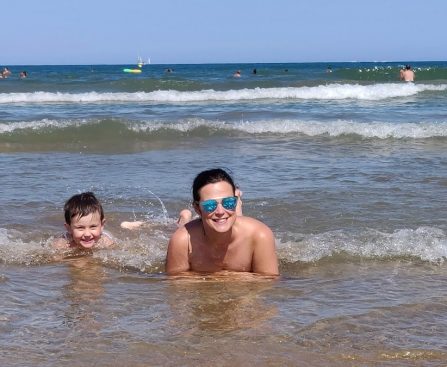 Two people enjoy the water at the beach